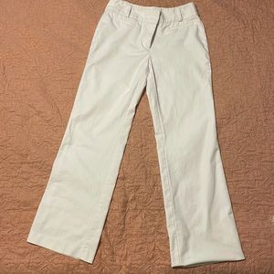 White pants w hem slightly undone